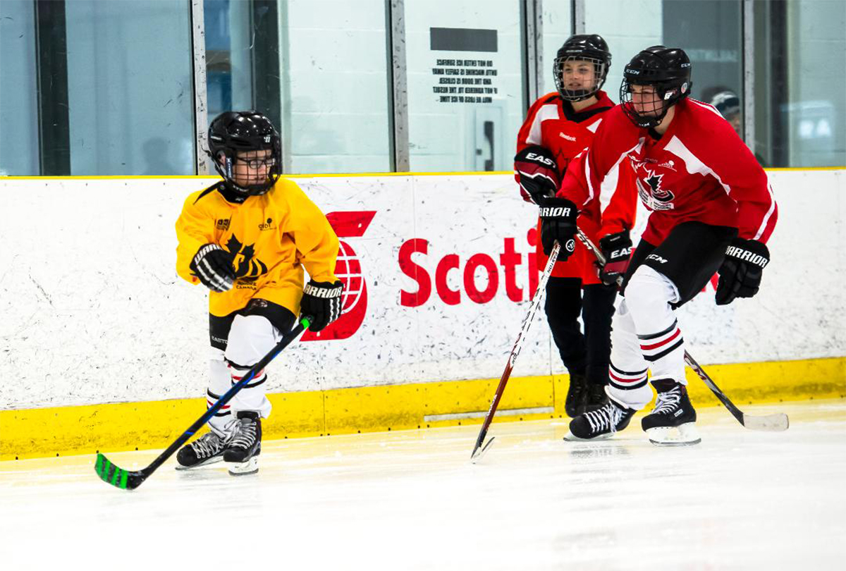 Two blind hockey players competing for the puck