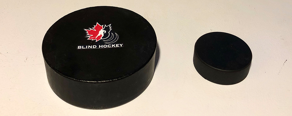 Adapted blind ice hockey puck